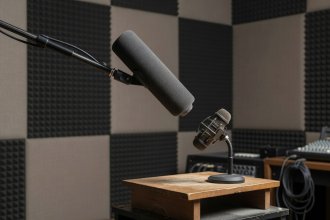 Shotgun boom microphone with windscreen in recording studio